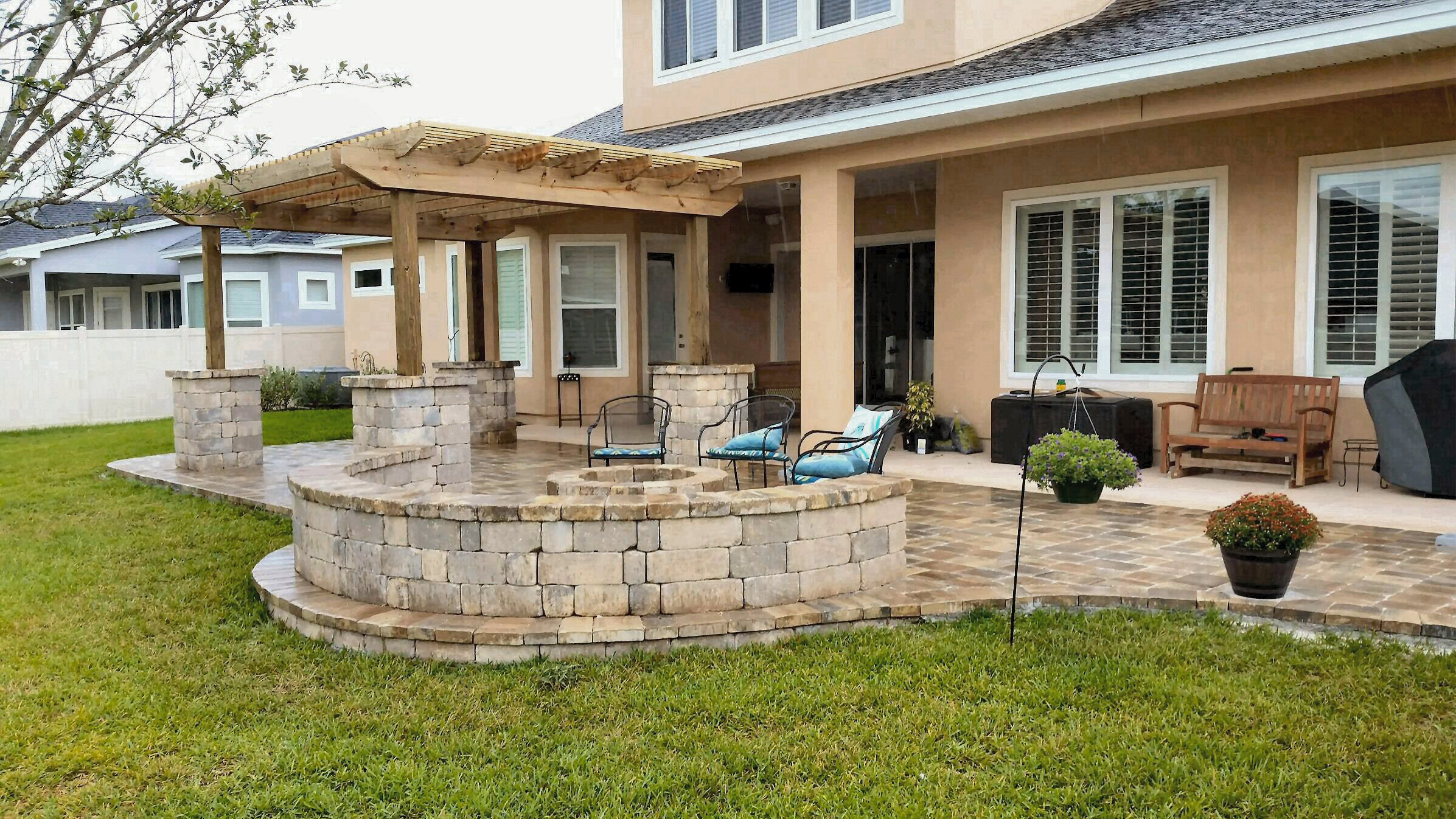 Patio with pergola fire pit and sitting wall Jacksonville